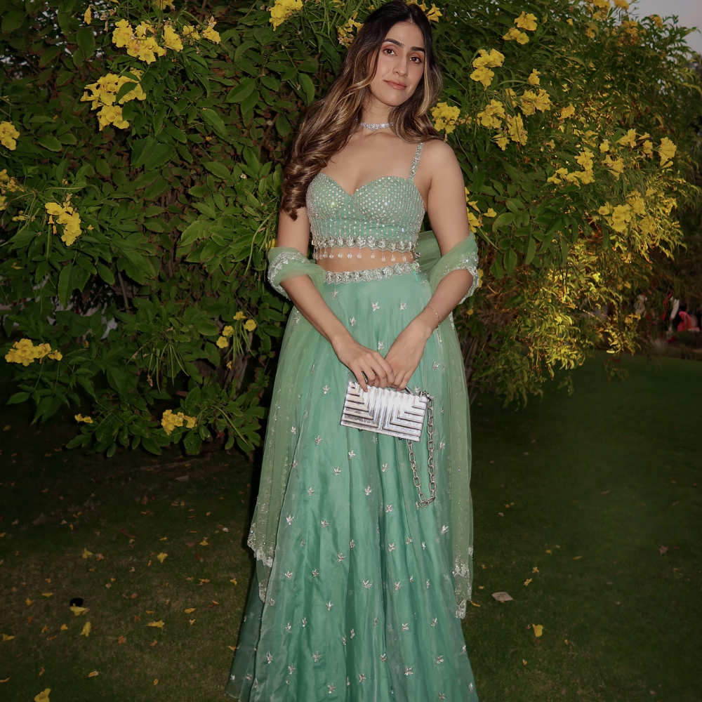 Zaara Gidwani styled her look with the L'afshar bag for elevated wedding guest style