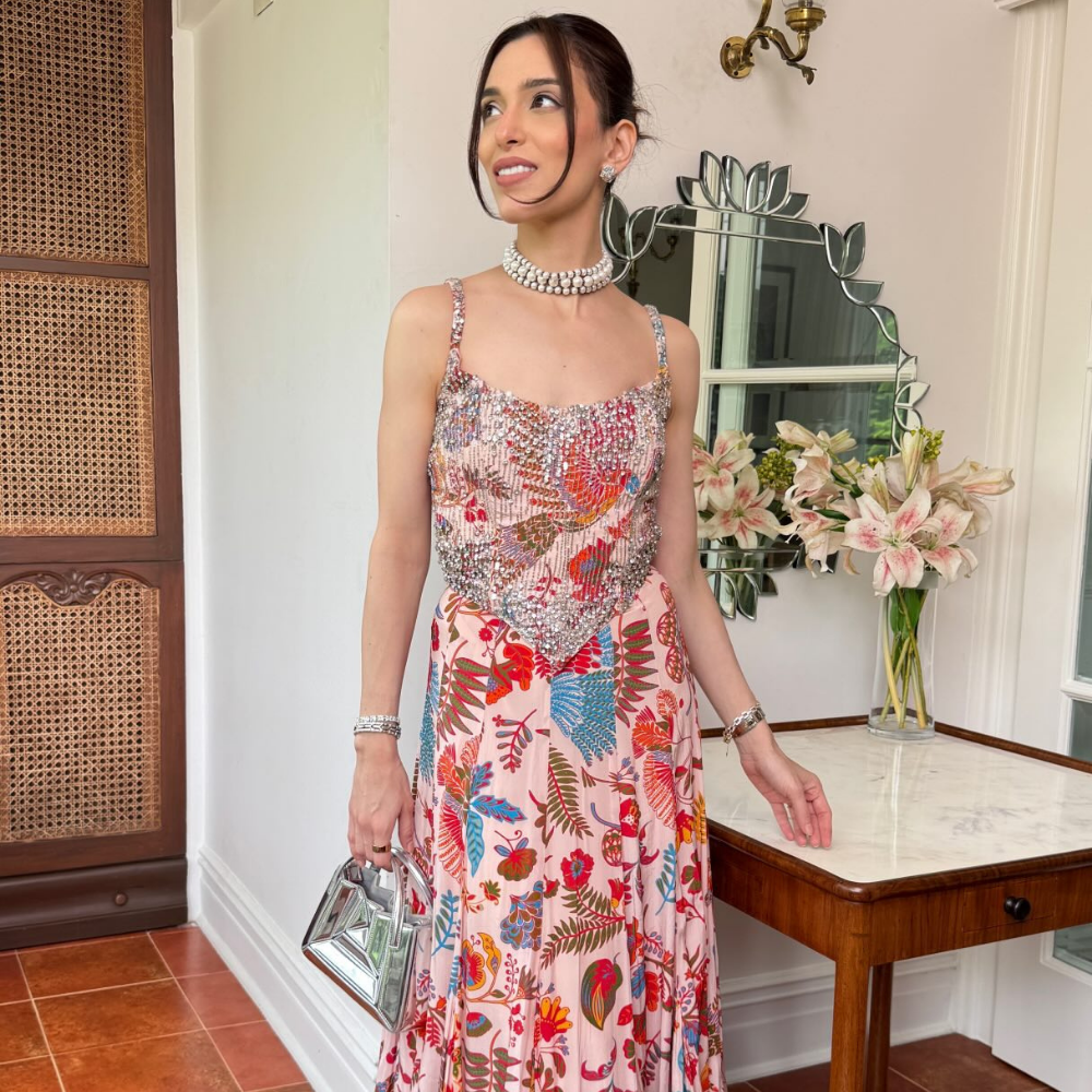 Maia Sethna completes her festive look with an AiSPi bag