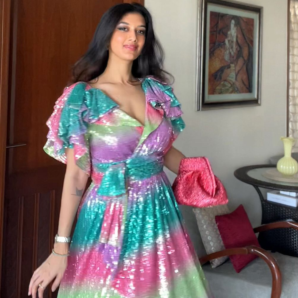 Naimita J makes statement in Celia b dress paired with Themoire bag